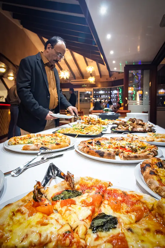 A table full of pizza at Gill's Restaurant Gibraltar